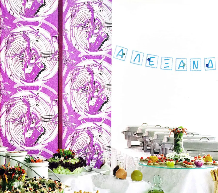 A buffet table with salads and platters