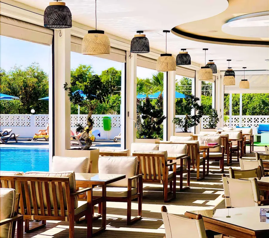 The restaurant terrace looking onto the pool